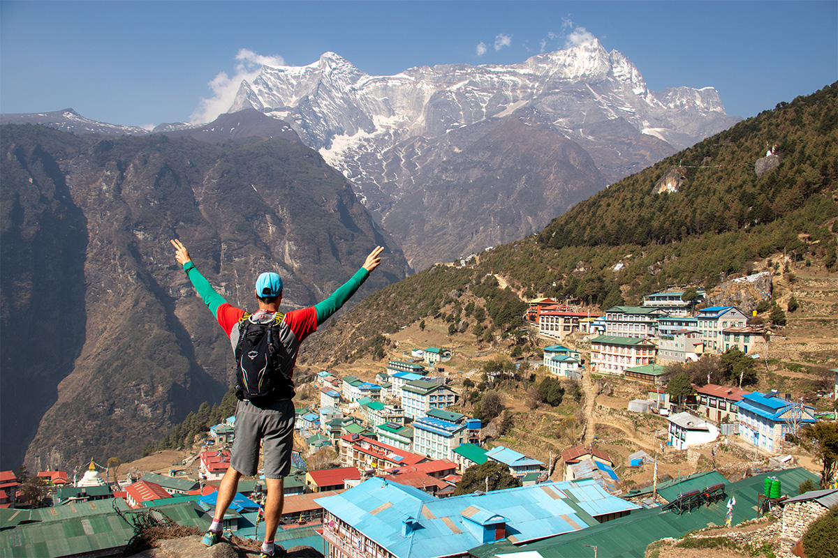 Traveler viewing the beautiful Namche Bazar with Konde Ri mountain at background