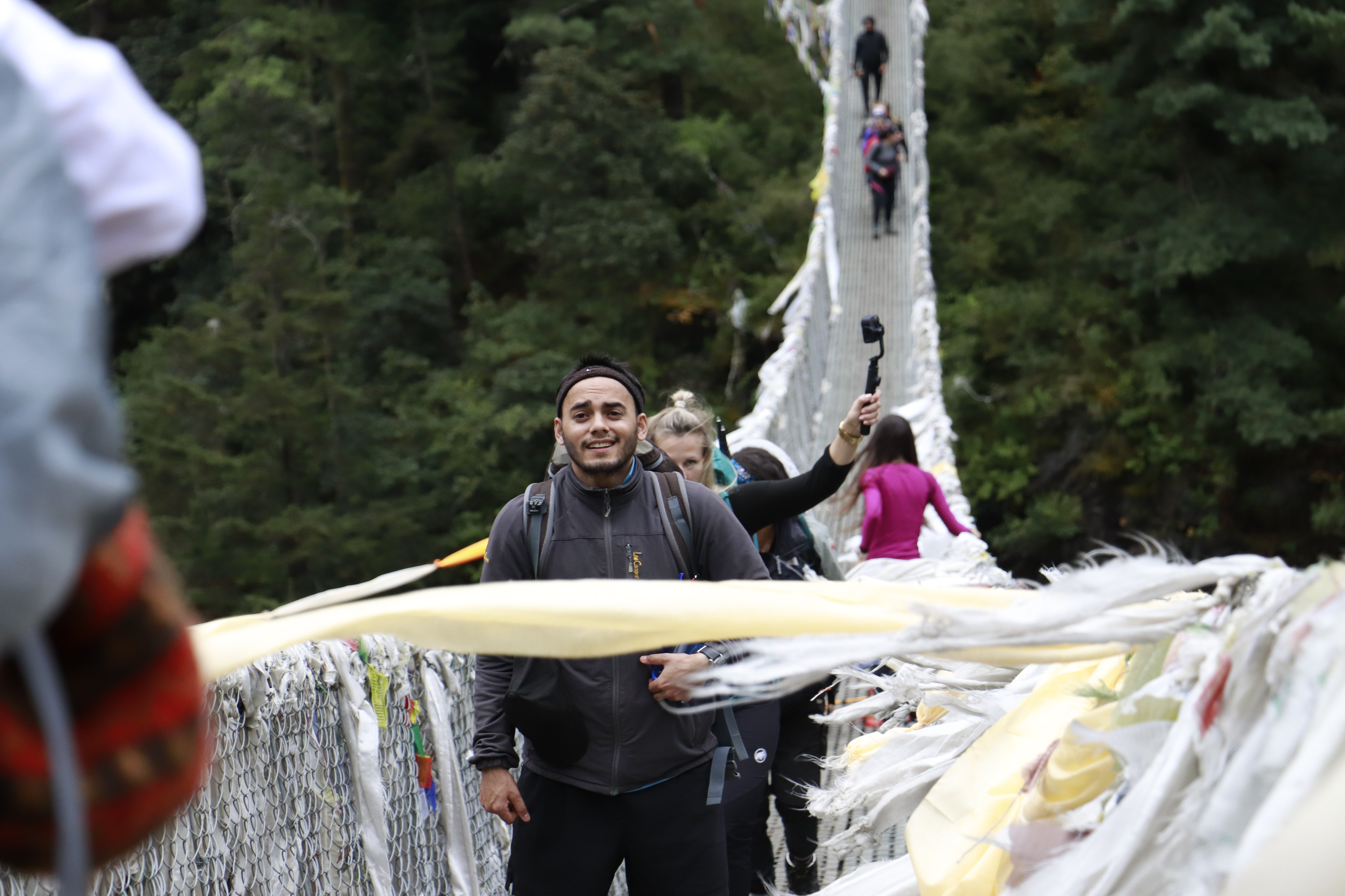 travelers walking at tenzing hillary bridge