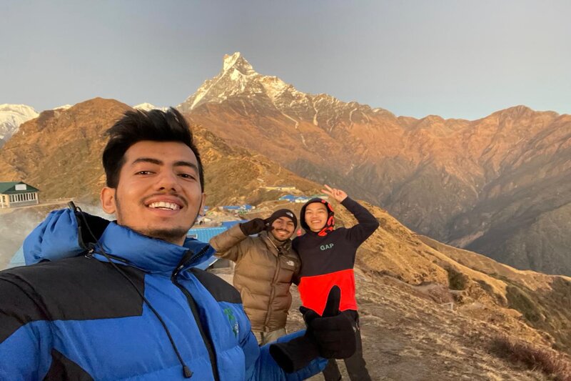 Travelers taking selfie with beautiful smiles in-front of Mardi Himal 